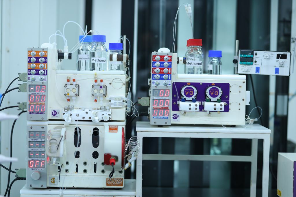 Advanced flow chemistry setup at Sai Life Sciences' Hyderabad Integrated Campus, featuring precision-controlled reactors and methanol-based chemical processing.