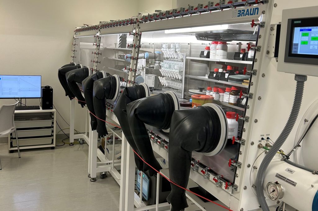 High-tech glovebox containment system at Sai Life Sciences' Alderley Park laboratory, enabling safe handling of sensitive pharmaceutical compounds in a controlled environment.