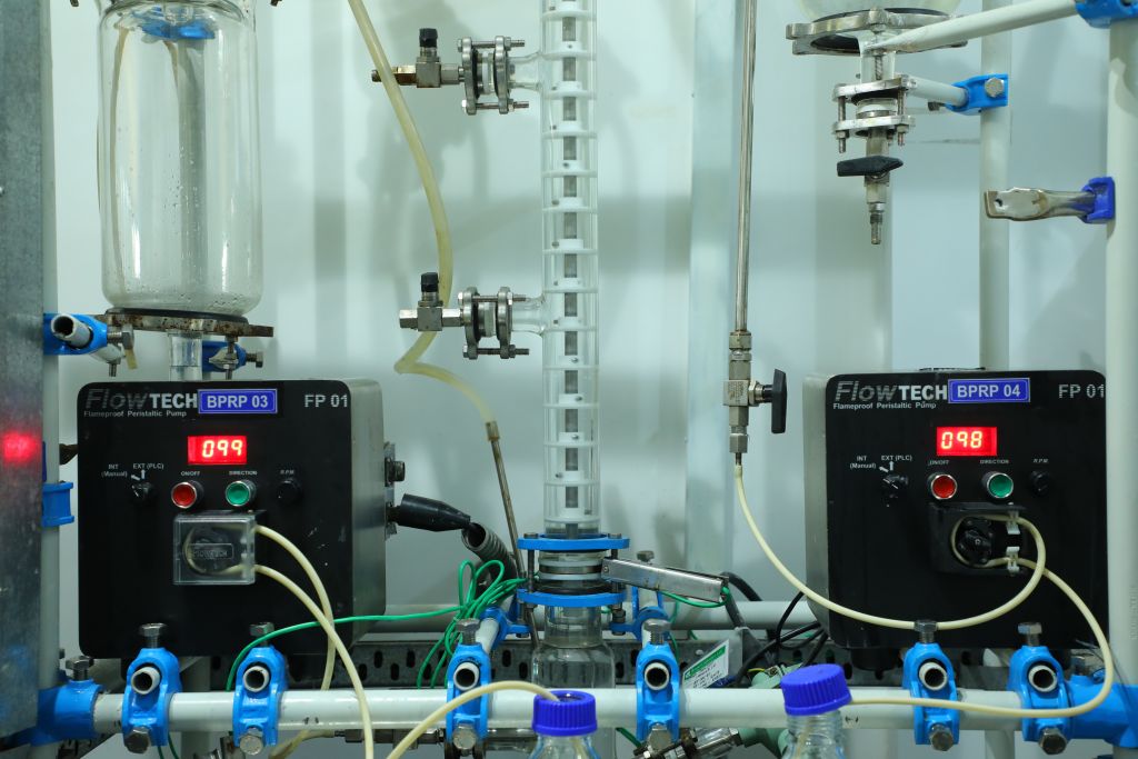 Advanced liquid-liquid extraction system at Sai Life Sciences' Hyderabad Integrated Campus, featuring FlowTech pumps and precision-controlled separation processes for pharmaceutical research
